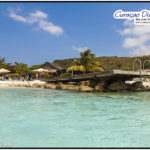 Der Steg von Playa Porto Marie, das Doppelriff in Curacao mit Tauchplatzkarte im Tauchreiseführer